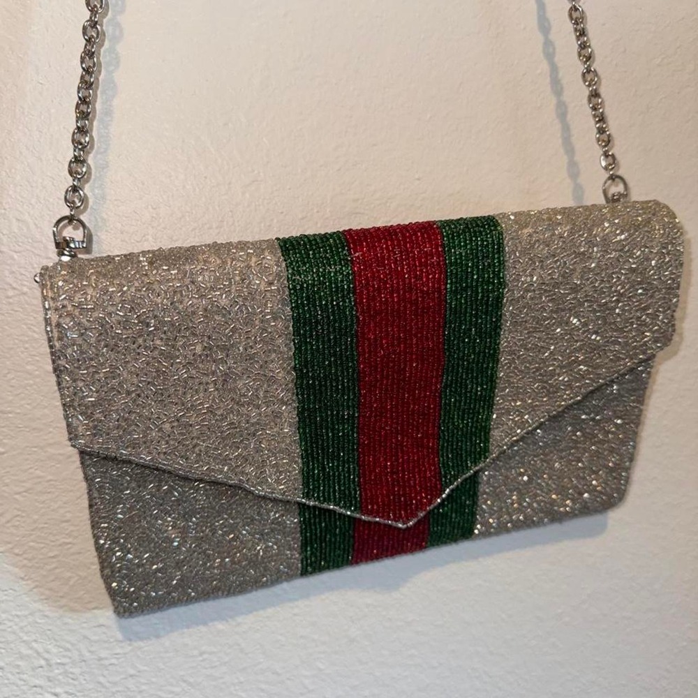 America & Beyond Silver glitter clutch with red and green vertical stripes